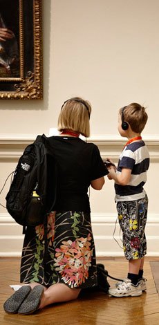 Parent and child on an audio tour